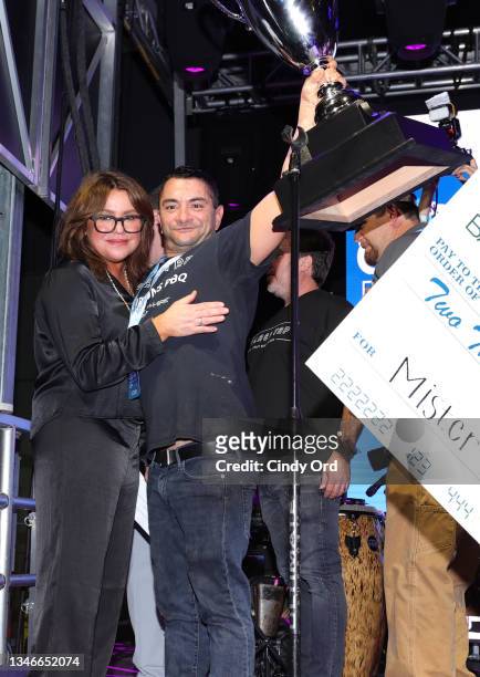 Stephen Parker of Black Tap Craft Burgers and Beer accepts the judge's choice award from Rachael Ray at the Blue Moon Burger Bash presented by Pat...