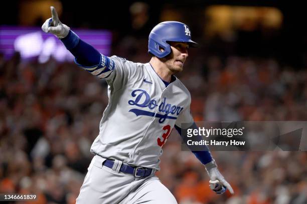 Cody Bellinger of the Los Angeles Dodgers celebrates his RBI single to score Justin Turner against the San Francisco Giants during the ninth inning...