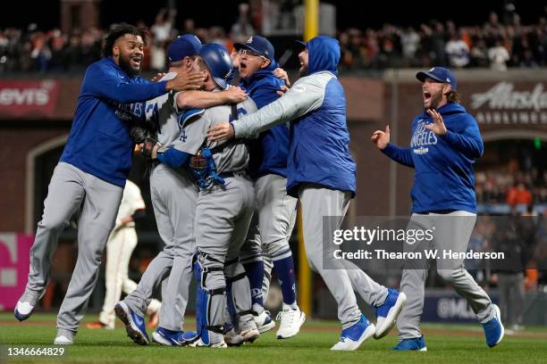 The Los Angeles Dodgers celebrate after beating the San Francisco Giants 2-1 in game 5 of the National League Division Series at Oracle Park on...