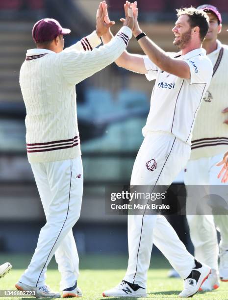 Mark Steketee of the Queensland Bulls celebrates the wicket of Nathan McSweeney of the Redbacks during day one of the Sheffield Shield match between...