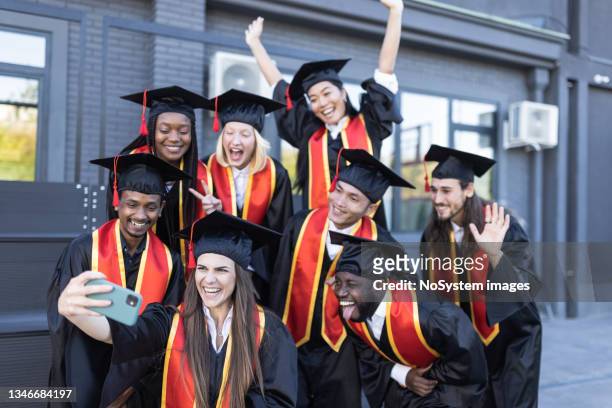 university students taking selfie just before the graduation ceremony - sash stock pictures, royalty-free photos & images