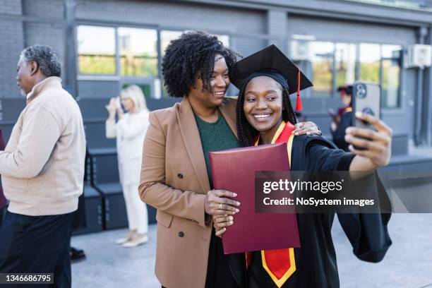 graduation. university students - mother congratulating stock pictures, royalty-free photos & images