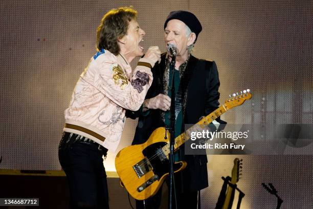 Mick Jagger and Keith Richards of The Rolling Stones perform onstage at SoFi Stadium on October 14, 2021 in Inglewood, California.