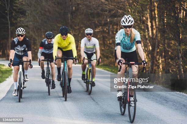 group of cyclist on the road - road cycling stock pictures, royalty-free photos & images