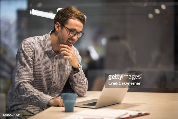 young happy entrepreneur working on a computer in the office. - marketing small business stock pictures, royalty-free photos & images