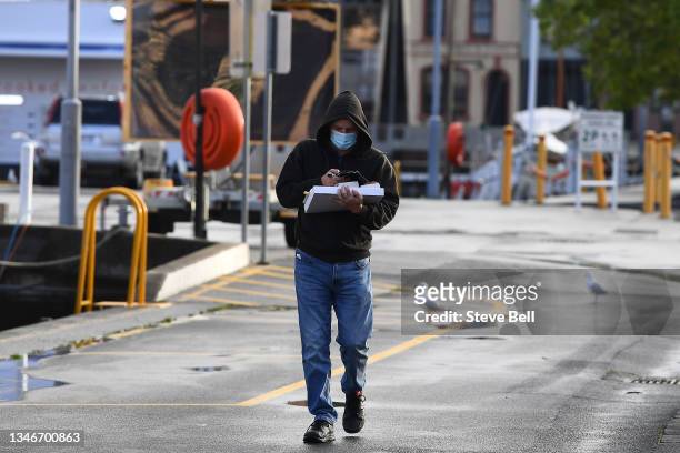 Tasmanians are seen buying takeaway during lockdown on October 15, 2021 in Hobart, Australia. Hobart and southern Tasmania will enter a snap...
