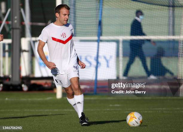 French President Emmanuel Macron playing with VCF during the charity football match between Varietes Club de France and CHI PSG , to benefit...