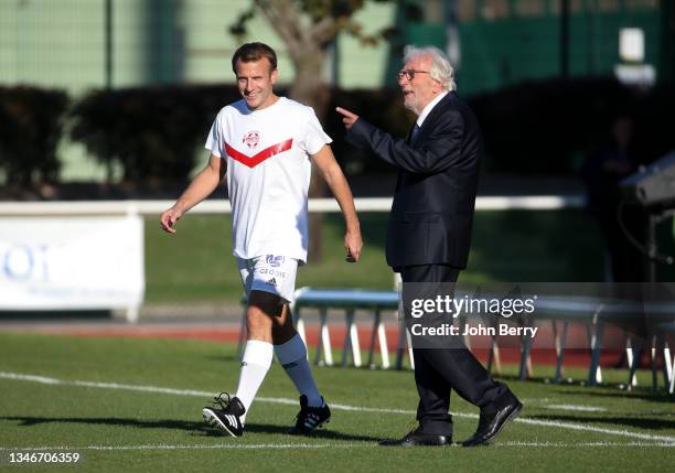 French President Emmanuel Macron, Jacques Vendroux, journalist and founder of Varietes Club de France during the charity football match between...