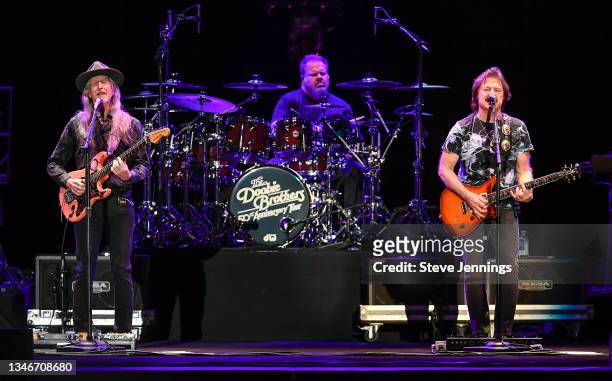 Patrick Simmons and Tom Johnston of The Doobie Brothers perform on the 50th Anniversary Tour at Toyota Amphitheatre on October 14, 2021 in Wheatland,...