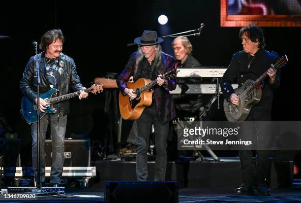 Tom Johnston, Patrick Simmons and John McFee of The Doobie Brothers perform on the 50th Anniversary Tour at Toyota Amphitheatre on October 14, 2021...