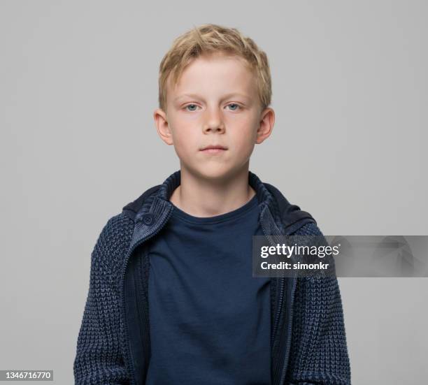 close-up of boy wearing blue jacket - one boy only stock pictures, royalty-free photos & images