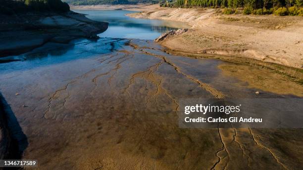 Cracks in the dry land through which the water of the Colomera reservoir flows on October 14, 2021 in Granada, Spain. The Colomera reservoir in the...