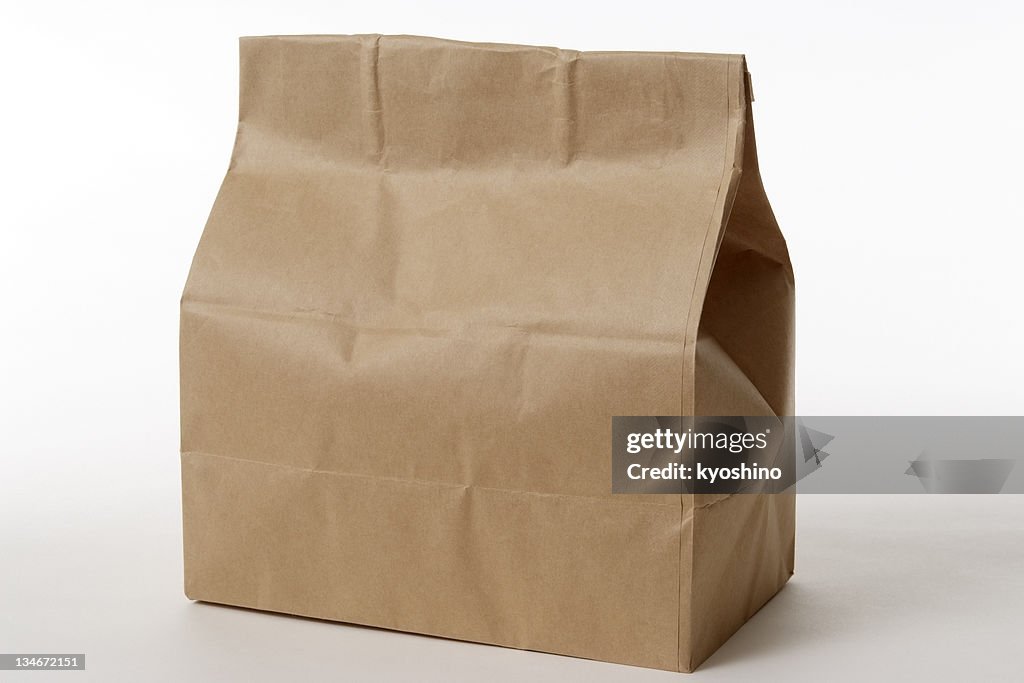 Isolated shot of closed brown paper bag on white background