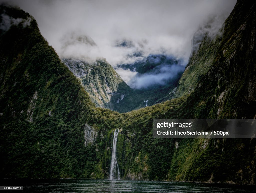 Scenic view of waterfall against sky,Milford Sound,Southland,New Zealand