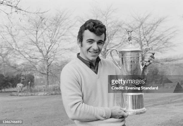 English golfer Tony Jacklin at his home in Elsham, Lincolnshire, with the US Open trophy after becoming the first non-American to win the tournament...