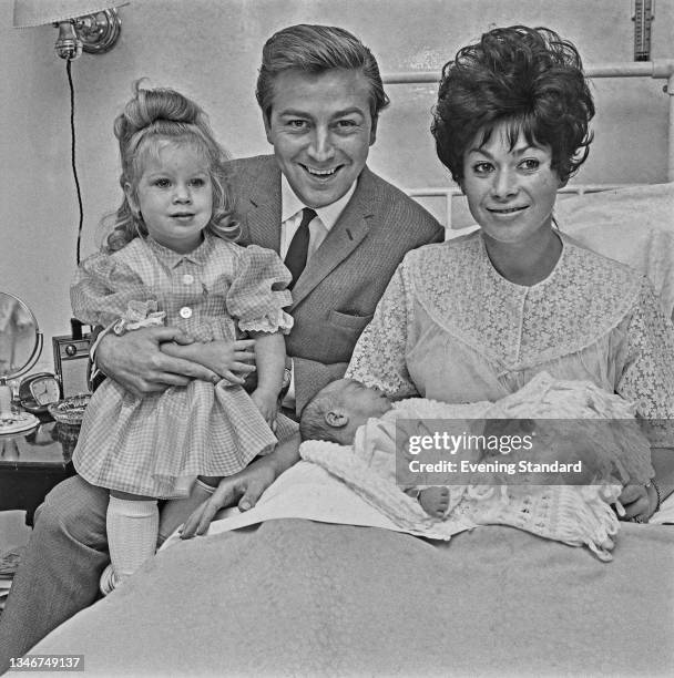 English comedian Des O'Connor with his wife Gillian and their two daughters Tracey and new baby Samantha, UK, 26th October 1964.