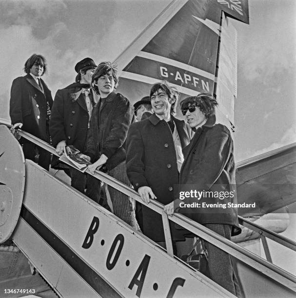 British rock band the Rolling Stones at London Airport , en route to the United States for their second American tour, UK, 23rd October 1964. From...