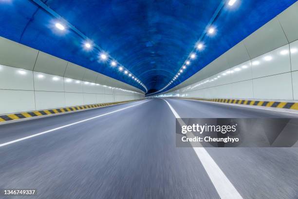 motion road and tunnel - light at the end of the tunnel stock pictures, royalty-free photos & images