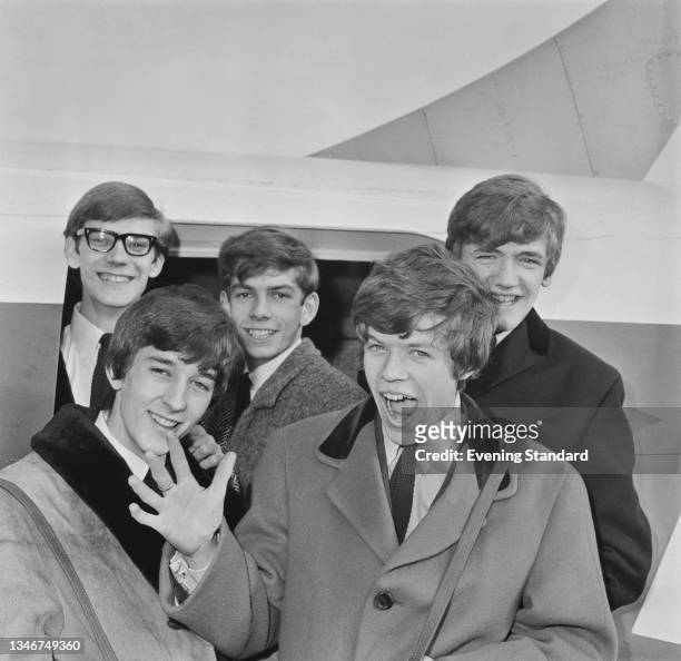 English pop group Herman's Hermits, UK, 12th December 1964. From left to right, they are guitarists Derek Leckenby and Keith Hopwood, drummer Barry...
