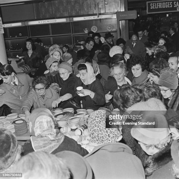 An end of year sale at Selfridges department store in London, UK, 30th December 1964.