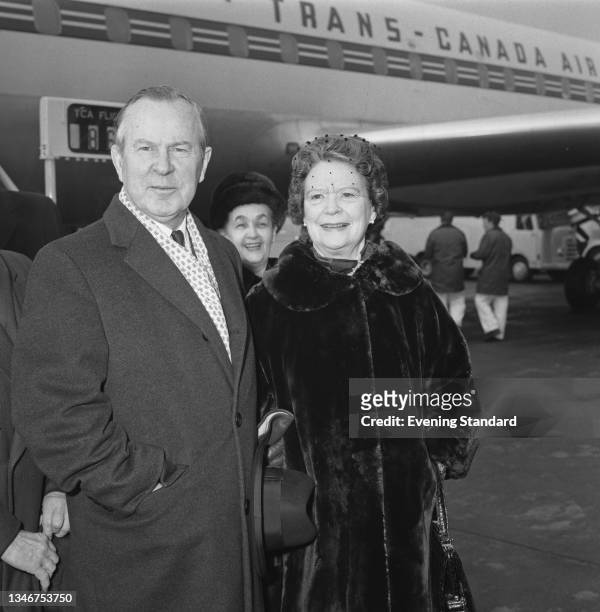 Lester B. Pearson , the Prime Minister of Canada, arrives at London Airport with his wife Maryon to attend the state funeral of former British Prime...