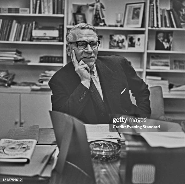 English actor and director Sir Laurence Olivier in his office at the National Theatre in London, UK, 4th February 1965.