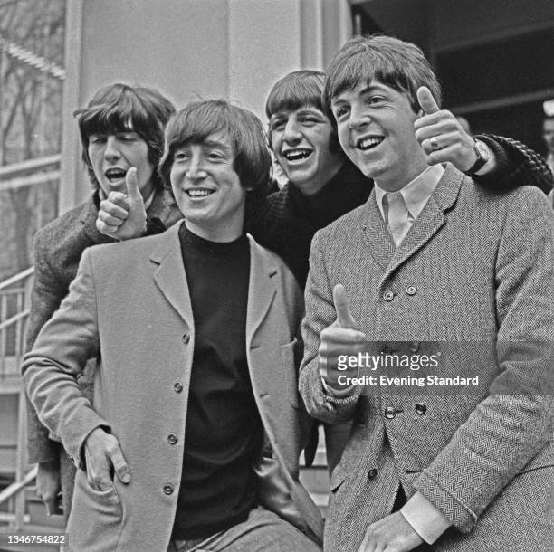 British rock group the Beatles pose outside Abbey Road Studios in London, after John Lennon passed his driving test, UK, 16th February 1965. From...