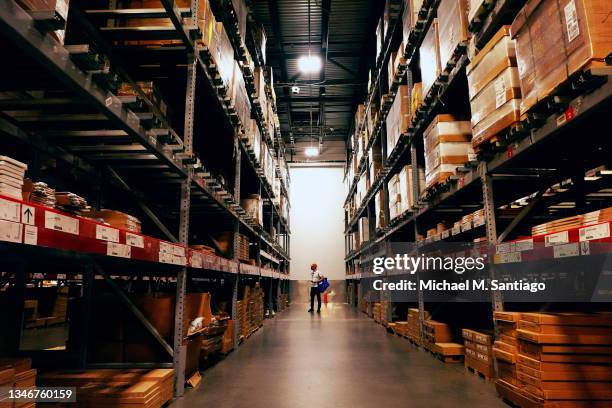 Person walks in the warehouse of an IKEA store on October 15, 2021 in the Red Hook neighborhood of Brooklyn borough in New York City. Executives at...