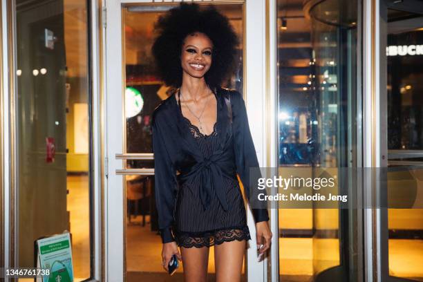 Model Aaliyah Hydes wears a black cardigan, balck slip top after the LaQuan Smith show on September 09, 2021 in New York City.