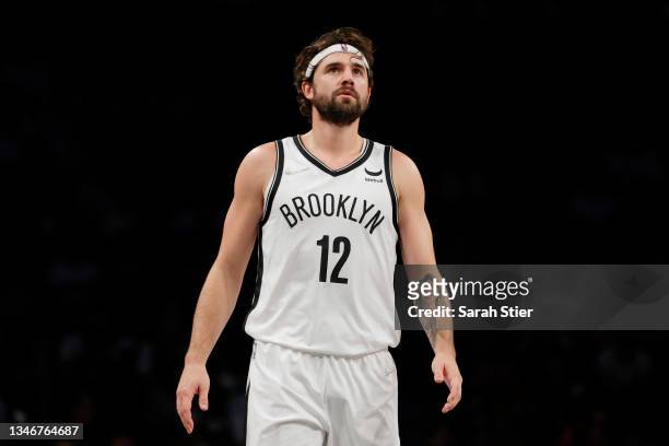 Joe Harris of the Brooklyn Nets looks on during the first half against the Minnesota Timberwolves at Barclays Center on October 14, 2021 in the...
