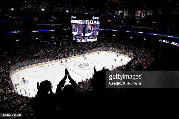 Fans cheer after Alexandre Texier of the Columbus Blue Jackets scores a goal during the game against the Arizona Coyotes at Nationwide Arena on...