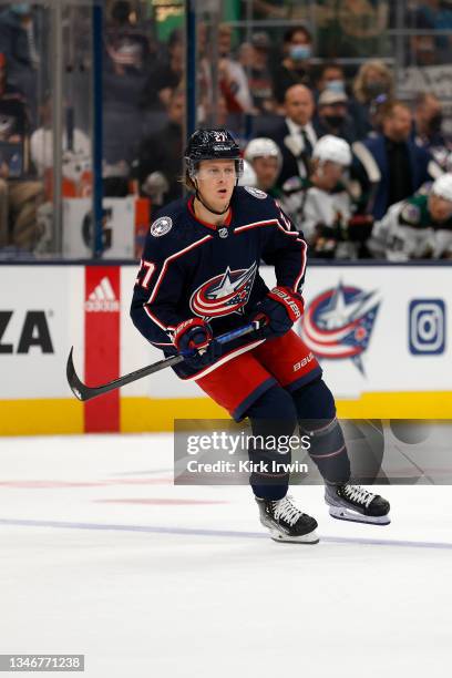 Adam Boqvist of the Columbus Blue Jackets skates after the puck during the game against the Arizona Coyotes at Nationwide Arena on October 14, 2021...