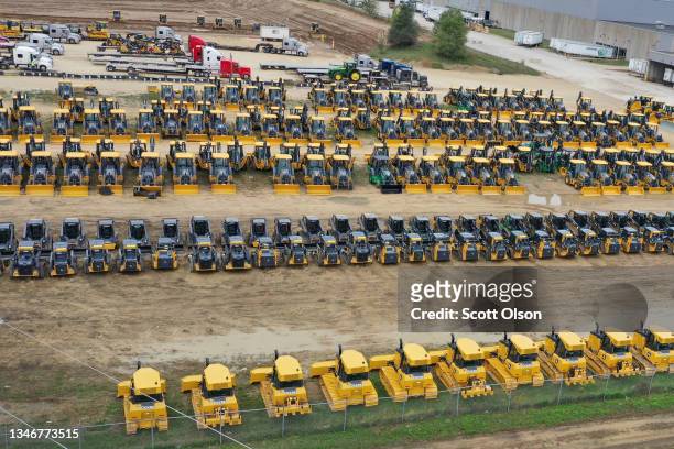 In this aerial view, construction and farming vehicles manufactured by John Deere sit in a yard at the John Deere Dubuque Works facility on October...