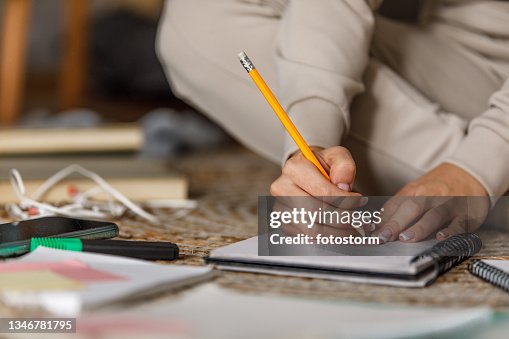 Writing notes while studying for a test Writing notes while studying for a test