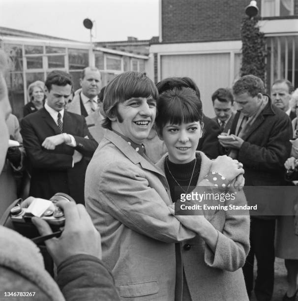 English drummer Ringo Starr of the Beatles with his wife Maureen Cox during their honeymoon in Hove, East Sussex, UK, 12th February 1965.