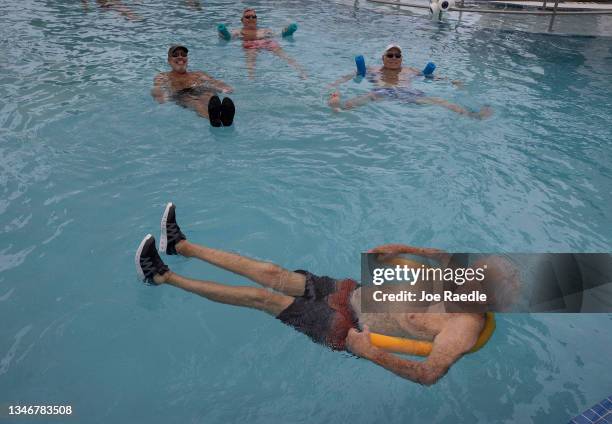 Dave Bayer participates in a water aerobics class in the John Knox Village Continuing Care Retirement Community pool, where he resides on October 15,...