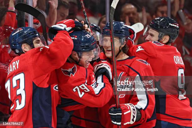 Hendrix Lapierre of the Washington Capitals celebrates his first career NHL goal with teammates against the New York Rangers during the second period...