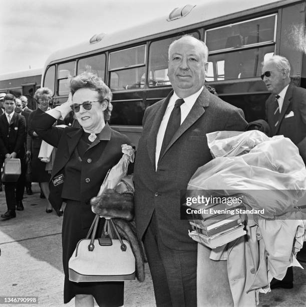 English film director Alfred Hitchcock with his wife, screenwriter and editor Alma Reville , UK, 15th June 1964.