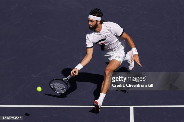 Stefanos Tsitsipas of Greece plays a forehand volley against Nikoloz Basilashvili of Georgia during their quarterfinal match on Day 12 of the BNP...