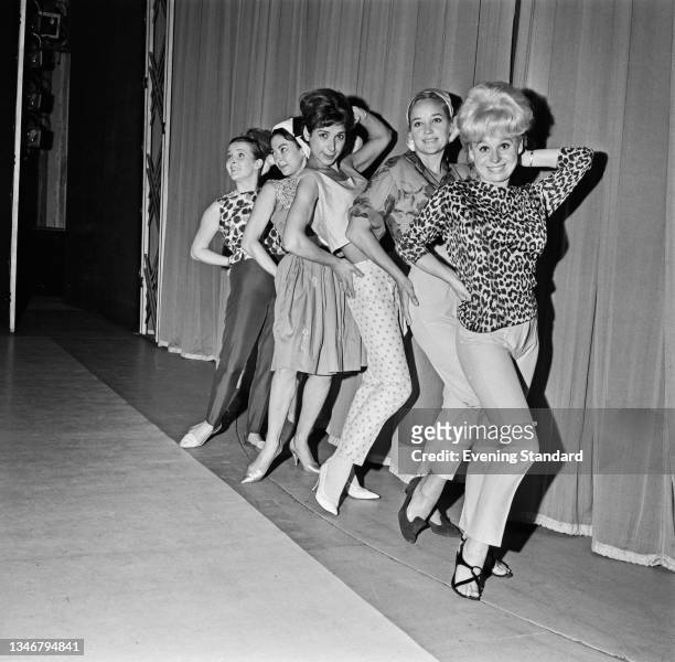Actresses Barbara Windsor, Sylvia Syms, Miriam Karlin, Rita Moreno and Millicent Martin, in line during a rehearsal for the 'Night of 100 Stars' at...