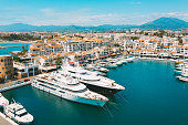 Aerial top view of luxury yachts in Puerto Banus marina, Marbella, Spain