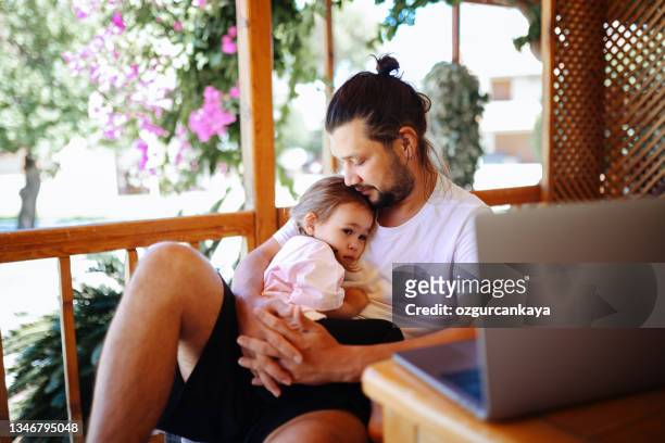 Father and daughter using a digital tablet together.