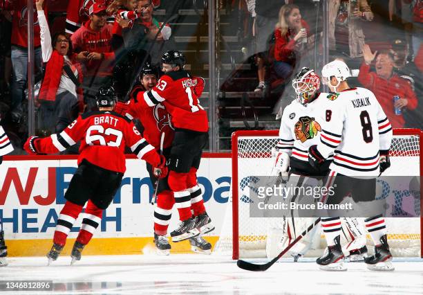 The New Jersey Devils celebrate a goal by Dougie Hamilton at 17 seconds of the first period against Kevin Lankinen of the Chicago Blackhawks at the...