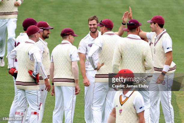 Mark Steketee of the Queensland Bulls celebrates the wicket of Travis Head of the South Australian Redbacks during day two of the Sheffield Shield...