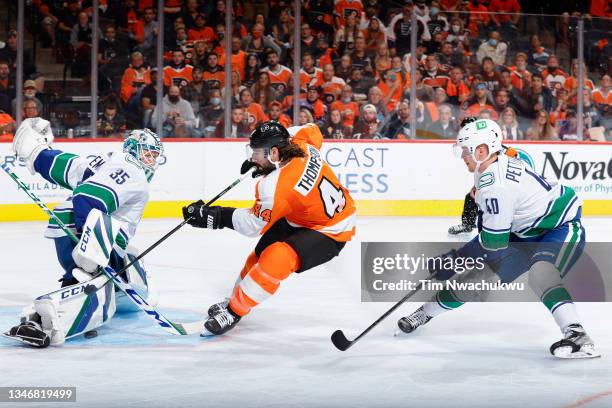 Thatcher Demko of the Vancouver Canucks blocks a shot by Nate Thompson of the Philadelphia Flyers during the second period at Wells Fargo Center on...