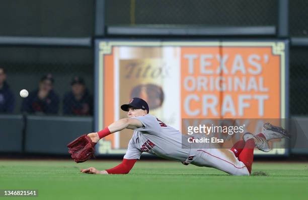 Enrique Hernandez of the Boston Red Sox makesa diving catch on a ball hit by Michael Brantley of the Houston Astros with the bases loaded to end the...