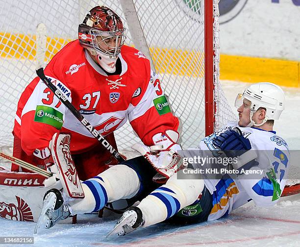 Goalkeeper Ivan Kasutin of the Spartak and Dustin Boyd of the Barys in the crease during the game between Barys and Spartak during the KHL...