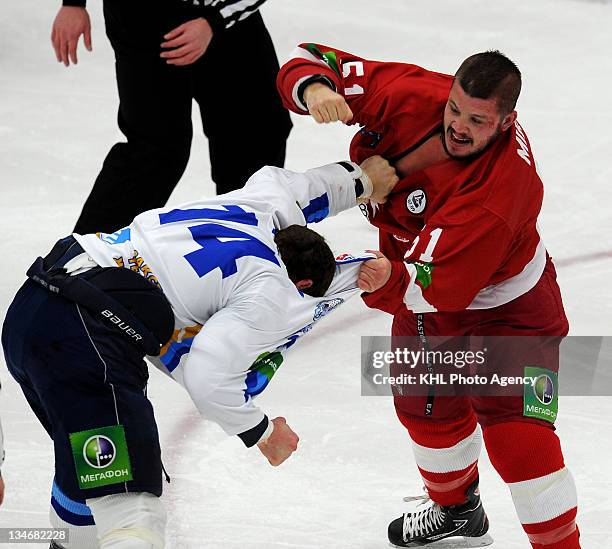 Jon Mirasty of the Vityaz and Josh Gratton of the Barys tangled up as they fight during the game between Barys and Vityaz during the KHL Championship...