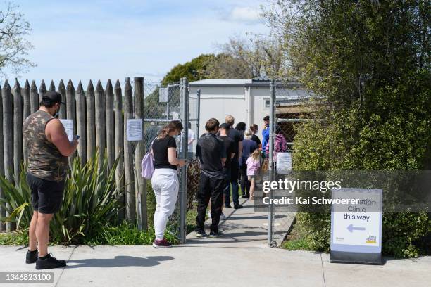 Members of the public queue up to get vaccinated at the Pages Road Vaccination Centre on October 16, 2021 in Christchurch, New Zealand. New Zealand...