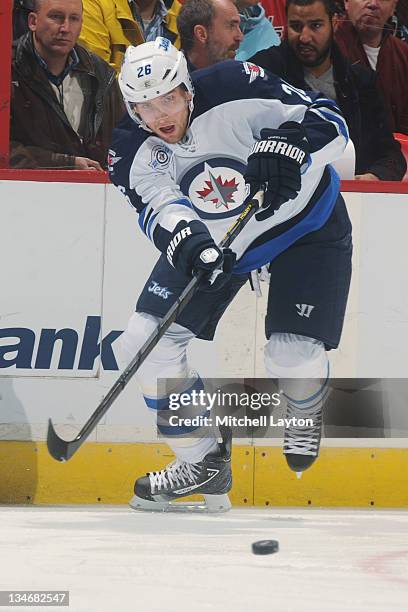 Blake Wheeler of the Winnipeg Jets passes the puck during a NHL hockey game against the Washington Capitals on November 23, 2011 at the Verizon...